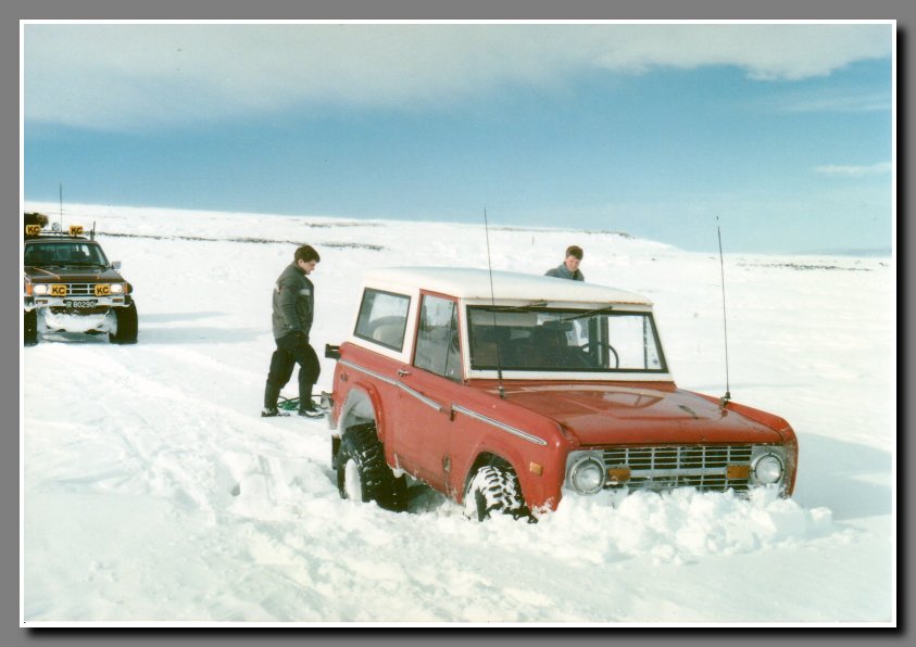 Trouble started as soon as we left the main road. Halli was leading the way in his Bronco and driving on what looked like a level snow covered ground. Oops, a snow covered rut. I guess we have to activate the four-wheel drive and let some air out of the tires.