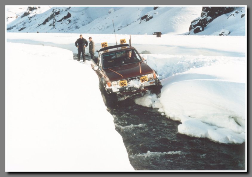 Notice the river is clear and quite tame. This river is a raging dirty glacier river in the summer when the glaciers are melting. It is not uncommon that the river could reach up to the yellow KC spotlight covers on the bumper during the summer.