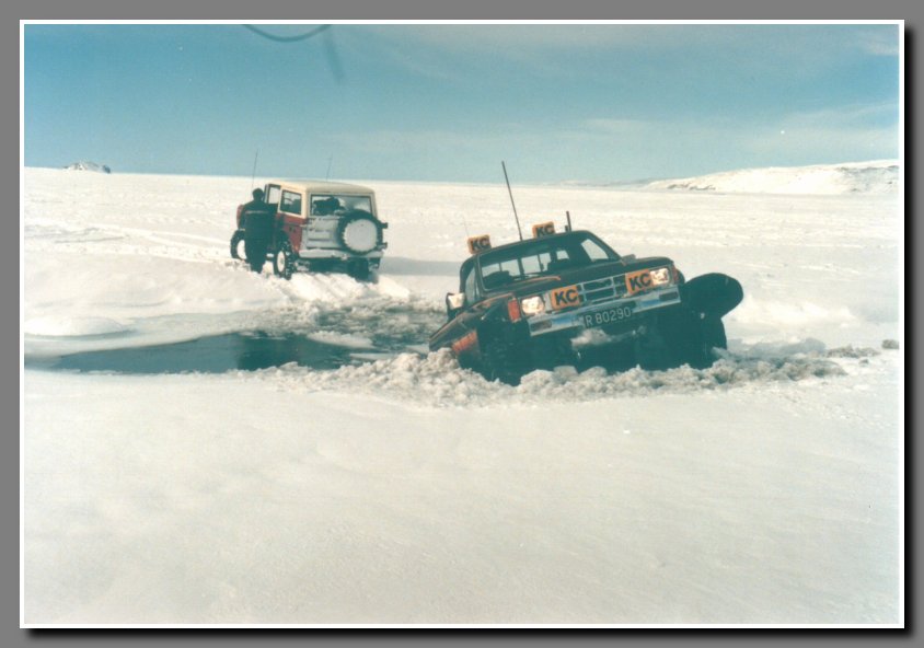 Oops, Aegirs truck got stuck trying to cross a snow-logged river. Notice Aegir digging with a shovel.